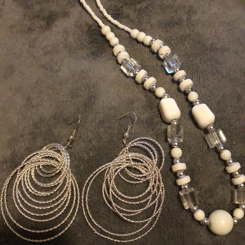 Multiple jewelry items. 3 pairs of earrings all pierced. 2 necklaces 3 bracelets